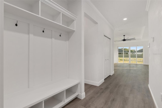 mudroom with wood-type flooring, ornamental molding, and ceiling fan