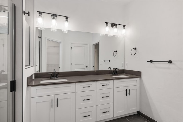 bathroom with tile patterned floors and vanity