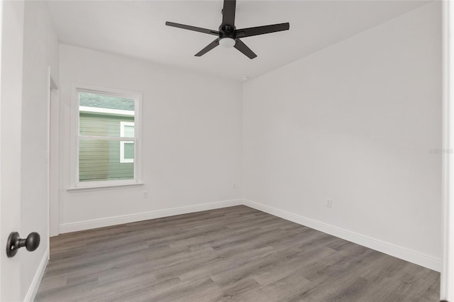 empty room featuring hardwood / wood-style flooring and ceiling fan