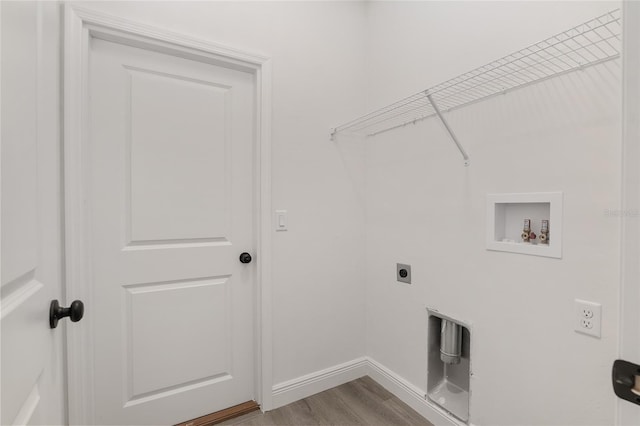 washroom with hookup for a washing machine, hookup for an electric dryer, and light hardwood / wood-style floors