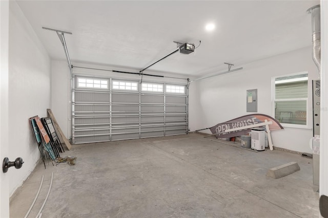 garage featuring a garage door opener and electric panel