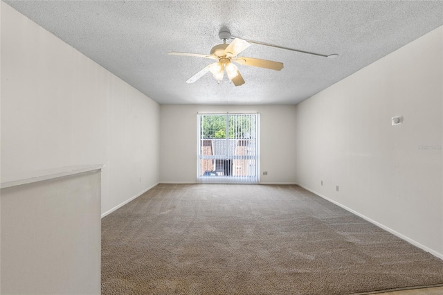 1700 SW 16th Ct Unit J-23, Gainesville, FL 32608 - spare room featuring ceiling fan, a textured ceiling, carpet, and baseboards