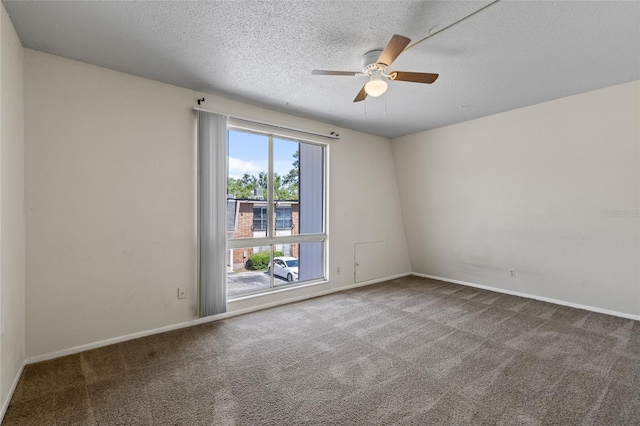 1700 SW 16th Ct Unit J-23, Gainesville, FL 32608 - empty room featuring carpet floors, ceiling fan, a textured ceiling, and baseboards