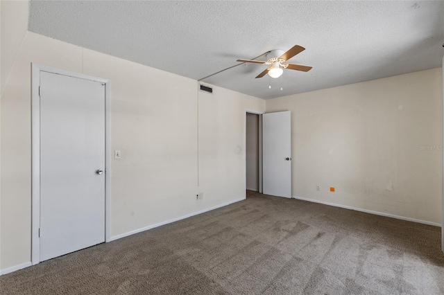 1700 SW 16th Ct Unit J-23, Gainesville, FL 32608 - unfurnished bedroom featuring carpet flooring, a textured ceiling, ceiling fan, and baseboards