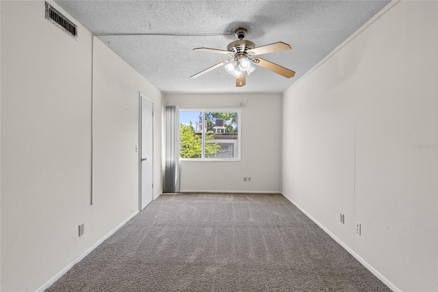 1700 SW 16th Ct Unit J-23, Gainesville, FL 32608 - unfurnished room featuring a textured ceiling, carpet floors, ceiling fan, and baseboards
