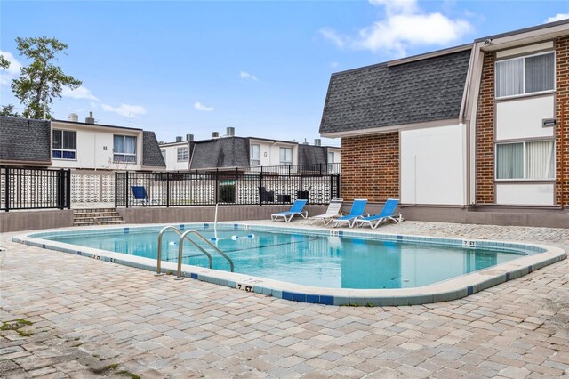 1700 SW 16th Ct Unit J-23, Gainesville, FL 32608 - community pool with fence and a patio