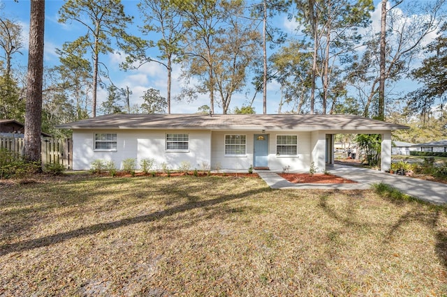 ranch-style house with a carport and a front yard