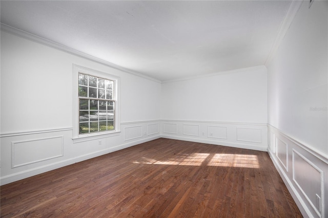 empty room with dark wood-type flooring and ornamental molding