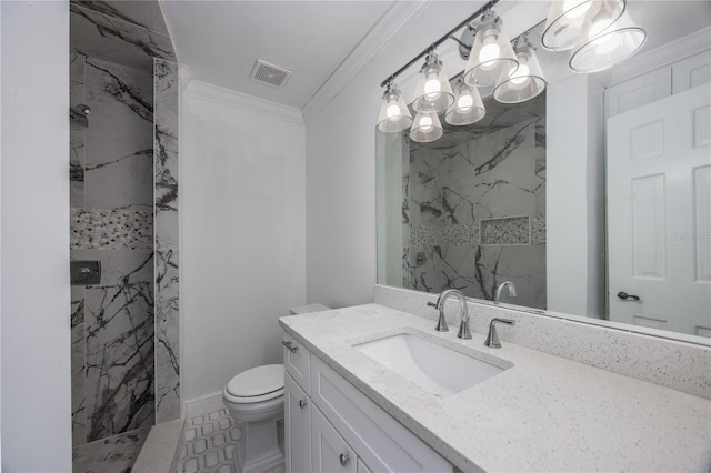 bathroom with crown molding, vanity, toilet, and a tile shower