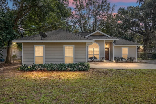 ranch-style house with a yard