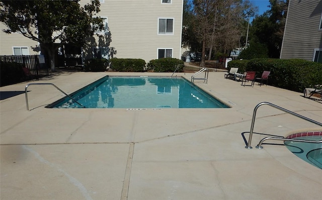 view of swimming pool featuring a patio