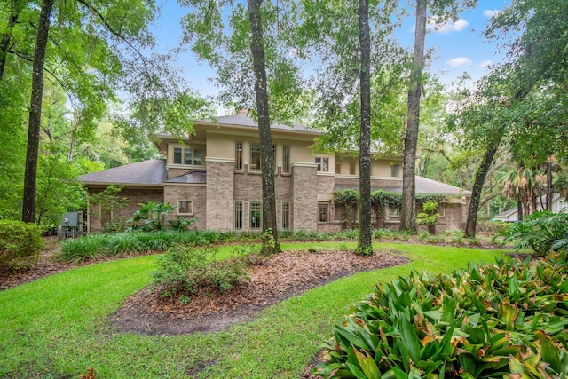 rear view of house with a lawn