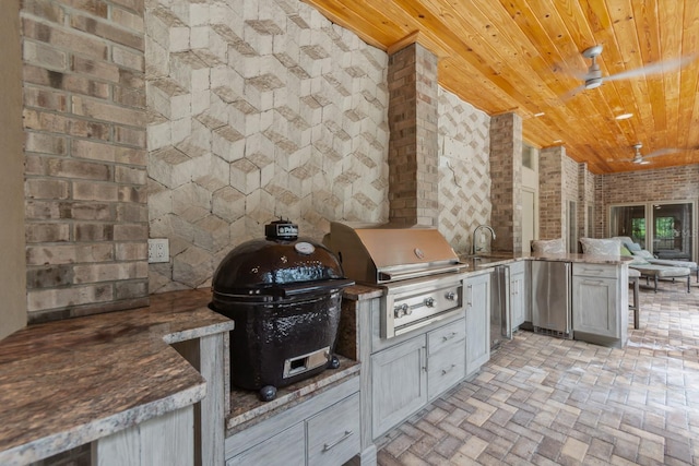 view of patio / terrace featuring ceiling fan, area for grilling, sink, and grilling area