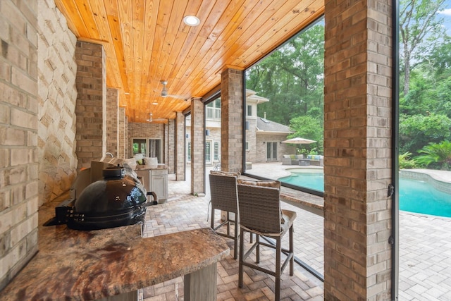 unfurnished sunroom featuring wooden ceiling