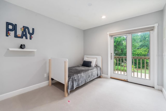 bedroom featuring carpet flooring and access to outside