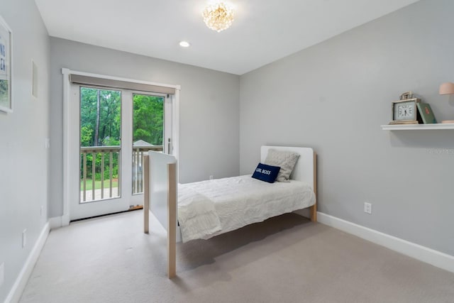 bedroom with multiple windows and light colored carpet