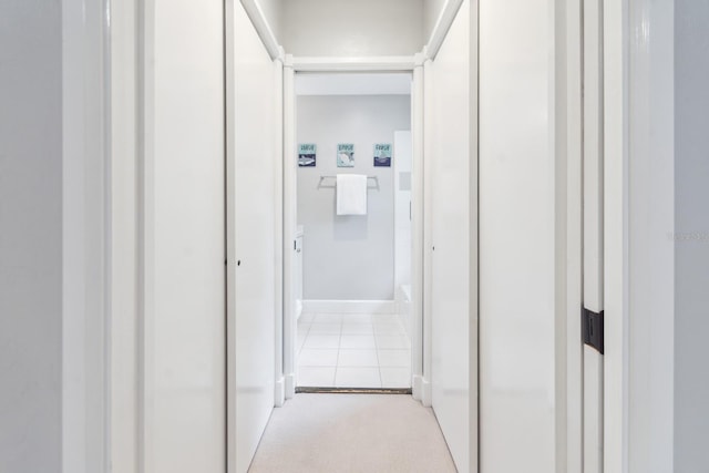 hallway featuring light tile patterned floors