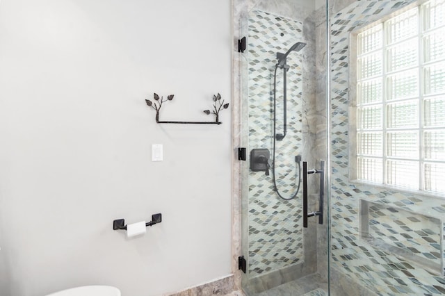 bathroom featuring an enclosed shower