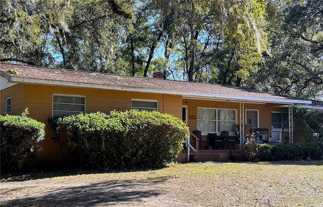 ranch-style house featuring a porch