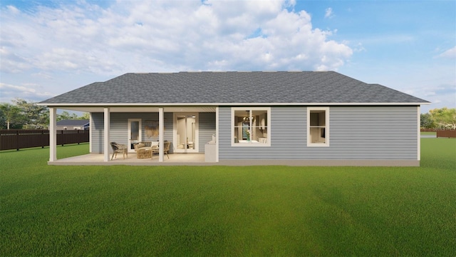 rear view of house featuring a yard and a patio area