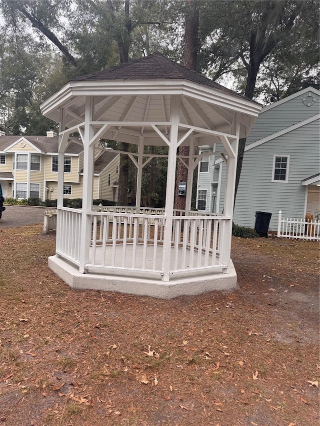 back of house featuring a gazebo