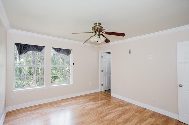 spare room featuring crown molding, ceiling fan, and light wood-type flooring