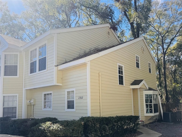 view of side of property featuring central AC unit