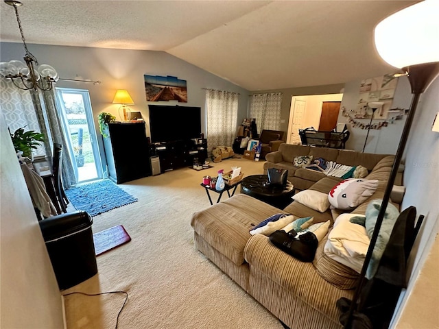 living room featuring lofted ceiling, carpet flooring, a chandelier, and a textured ceiling