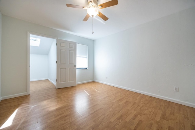 empty room with ceiling fan and light wood-type flooring