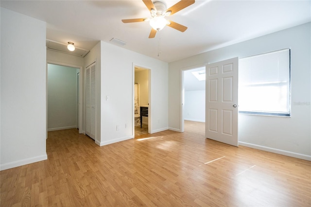 spare room featuring ceiling fan and light wood-type flooring