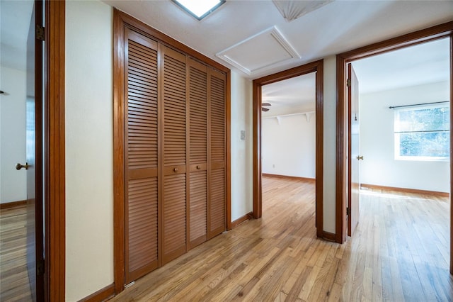 hall with light wood-type flooring