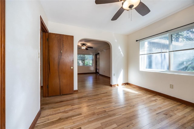 spare room featuring ceiling fan and light hardwood / wood-style floors