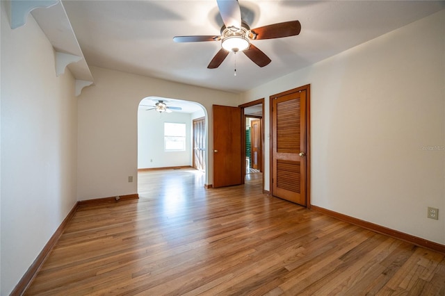 unfurnished room featuring ceiling fan and light hardwood / wood-style floors