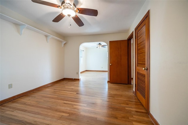 unfurnished room featuring ceiling fan and light wood-type flooring