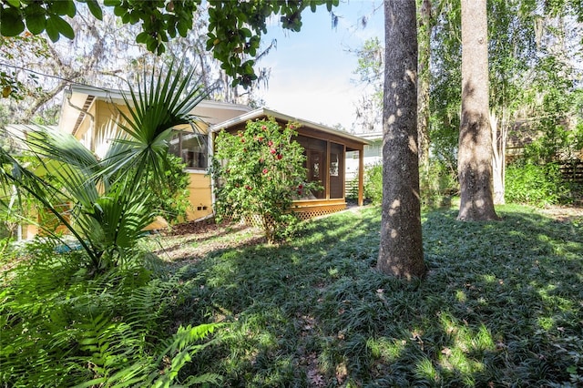 view of yard with a sunroom