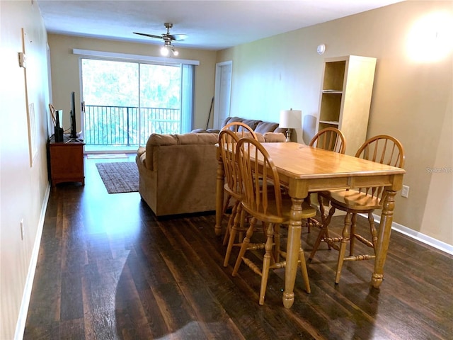 dining space with ceiling fan and dark hardwood / wood-style flooring