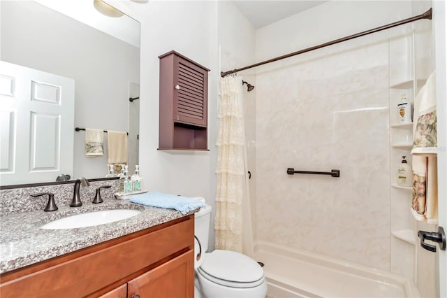 bathroom featuring a shower with curtain, vanity, and toilet