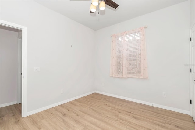 empty room featuring ceiling fan and light hardwood / wood-style flooring