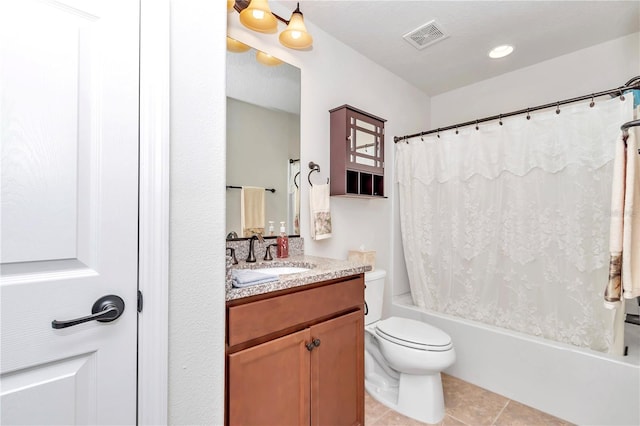 full bathroom featuring tile patterned flooring, vanity, shower / bath combination with curtain, and toilet