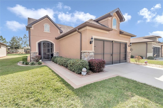 view of front of home with a garage and a front lawn