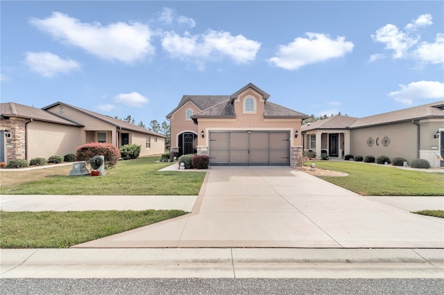 view of front of house with a garage and a front lawn