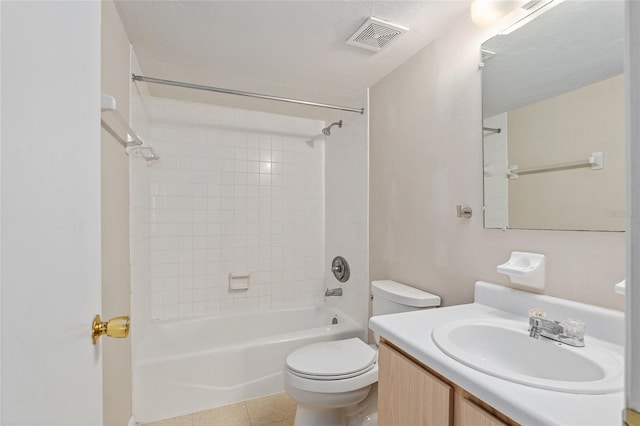 full bathroom with vanity, toilet, tiled shower / bath combo, and tile patterned flooring