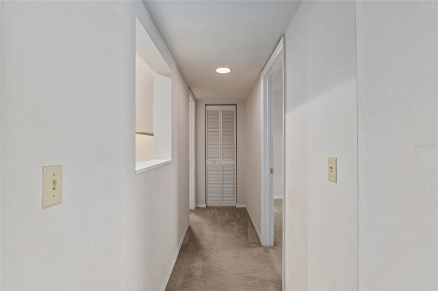 corridor with light carpet