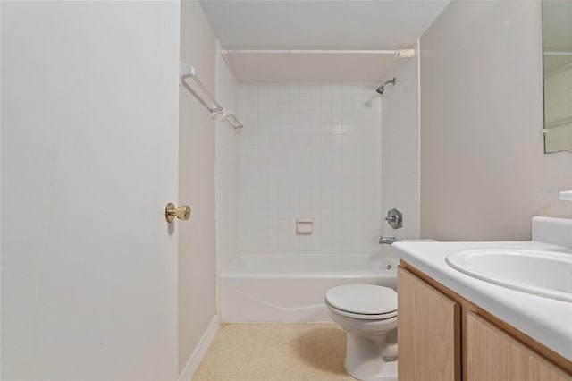 full bathroom with tiled shower / bath, vanity, and toilet