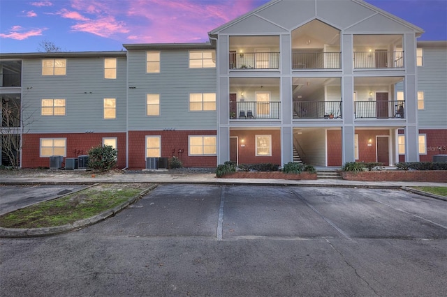 outdoor building at dusk featuring central AC unit