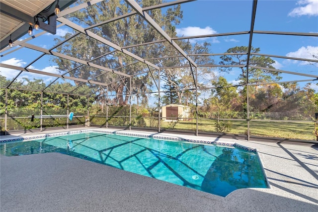 pool featuring a lanai, a storage shed, and a patio