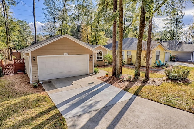 ranch-style house with a garage and a front lawn