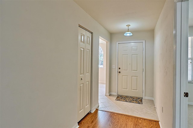 foyer entrance featuring plenty of natural light and light wood-type flooring