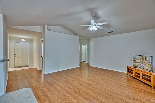 living room featuring ceiling fan, lofted ceiling, and light hardwood / wood-style floors