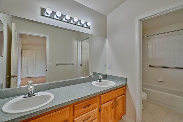 full bathroom featuring vanity, tile patterned flooring, toilet, and shower / bath combination